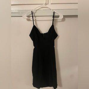 Black mini dress with cute out sides to accentuate curves